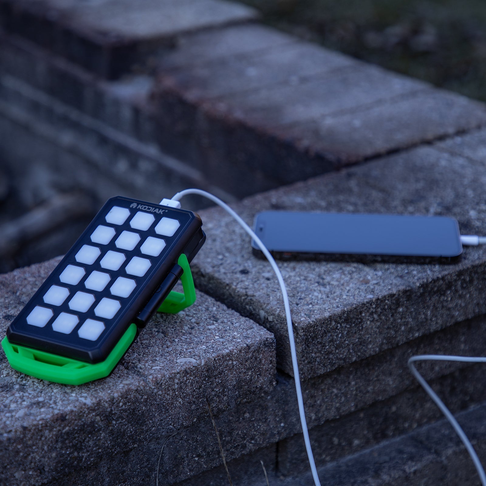 Kodiak® Klutch® 10000 mAh Power Bank with USB or Solar Charging and 1100 Lumen Work Light